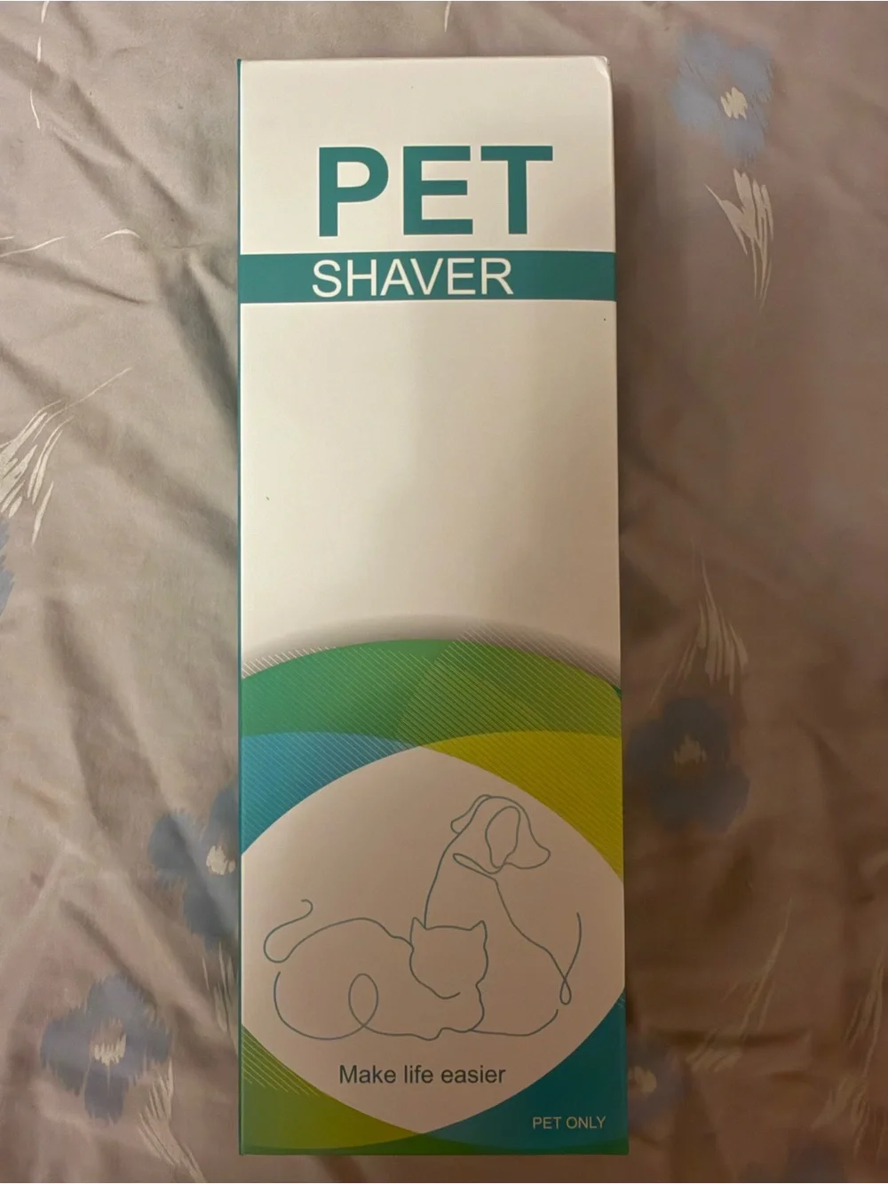 This a green electric pet shaver designed for trimming hair on dogs and cats.